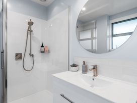 A bathroom with a shower and sink at Bayview Haven - Waikawa Retreat in Picton