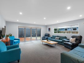 A living room with sofas and a coffee table at Bayview Haven - Waikawa Retreat in Picton