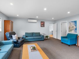 A living room with sofas and a coffee table at Bayview Haven - Waikawa Retreat in Picton