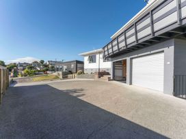 A driveway and garage area at Taupo view road holiday home in Taupo