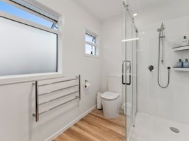 A bathroom with shower and toilet at Taupo view road holiday home Taupo