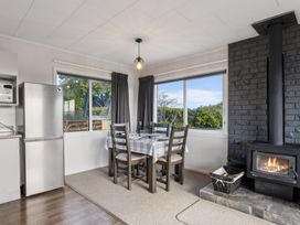 A dining area with a table and chairs at Taupo view road holiday home in Taupo
