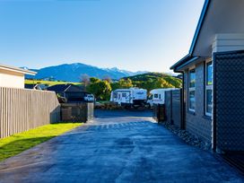 An outdoor view with parked vehicle and mountains at Kaikoura