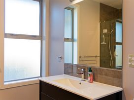 A bathroom with a sink and mirror at Kaikoura