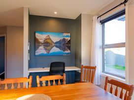 A dining room with a table and chairs at Kaikoura