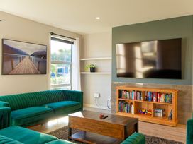 A living room with sofas and a television at Kaikoura
