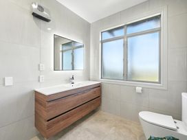 A bathroom with a vanity and sink at The Alpine Edge - Windwhistle Holiday Home in Canterbury
