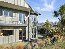 A house with a balcony and garden at The Alpine Edge - Windwhistle Holiday Home, Canterbury