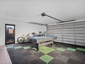 A garage with a billiard table and bicycles at Sunrise Hideaway - Cromwell