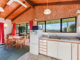 A kitchen with a refrigerator and sink at Quail Rise - Collingwood Holiday Home in Collingwood