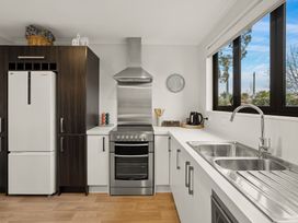 A kitchen with a refrigerator and oven at Vista Haven - Bannockburn Holiday Home Bannockburn
