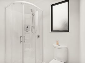 A bathroom with a shower and toilet at Vista Haven - Bannockburn