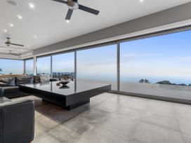A living room with sofa and coffee table at The Glasshouse at Block295 Raglan