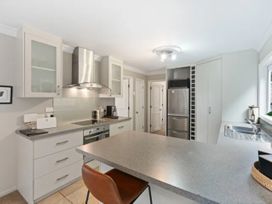 A kitchen with a countertop and appliances at Acacia Horizons - Taupo Holiday Home, Acacia Bay