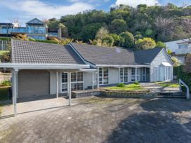 A house with garage and driveway at Acacia Horizons - Taupo Holiday Home Acacia Bay