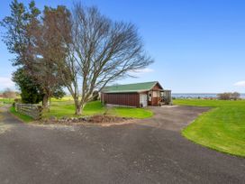 A house with trees and a grassy area at Rotorua, Rotorua