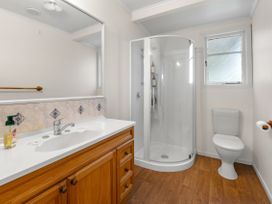 A bathroom with a vanity sink and shower at Rotorua