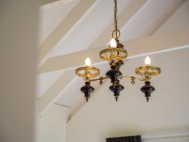 A chandelier with light bulbs in a room at Rotorua
