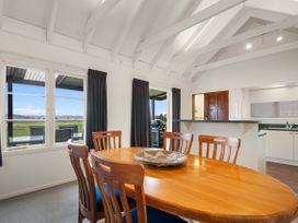 A dining room with a table and chairs at Rotorua
