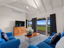A living room with a television and coffee table at Rotorua