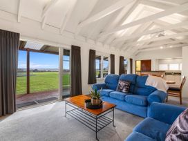 A living room with a sofa and coffee table at Rotorua in Rotorua