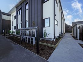 An outdoor area with mailboxes and pathways at Central Crossing - Christchurch Holiday Home in Christchurch