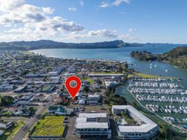 An aerial view of a town and marina at Creed Cottage - Whitianga Holiday Home in Whitianga