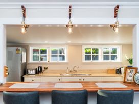 A kitchen with a countertop and kitchen appliances at Creed Cottage - Whitianga Holiday Home, Whitianga
