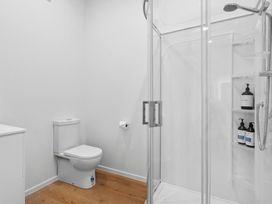 A bathroom with a shower and toilet at Arbor Villa - Greytown Holiday Home