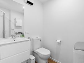 A bathroom with a toilet and sink at Arbor Villa - Greytown Holiday Home in Greytown