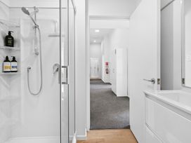 A bathroom with a shower and vanity at Arbor Villa - Greytown Holiday Home Greytown