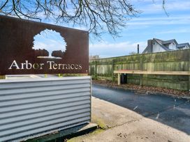 A sign for Arbor Terraces with a pathway at Arbor Villa - Greytown Holiday Home Greytown