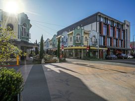 A street view with buildings and outdoor seating at Downtown Haven - Christchurch Holiday Apartment Christchurch