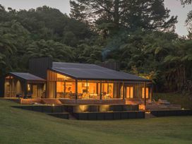 A house with a deck and garden at Lake Rotoiti in Rotorua
