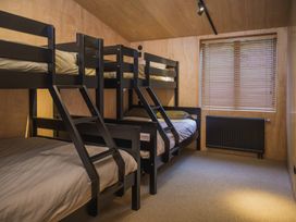 A bedroom with bunk beds and a radiator at Lake Rotoiti, Rotorua