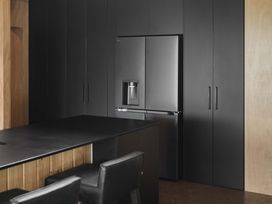 A kitchen with a refrigerator and countertop at Lakefront Luxury at Okere Falls Lake Rotoiti