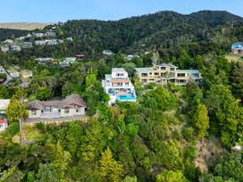 A scenic view of houses and greenery overlooking hills at Paihia Holiday Home in Paihia