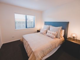 A bedroom with a bed and window at 