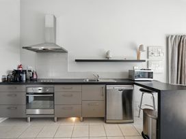 A kitchen with a sink and appliances at Tussock Cottage - Canterbury Holiday Home, Canterbury