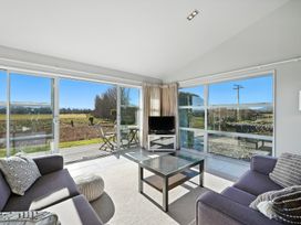 A living room with a coffee table and sofa at Flax Cottage - Canterbury Holiday Home in Canterbury