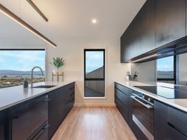 A kitchen with a sink and countertop at Nelson Holiday home in Nelson