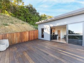 A deck area with a view of the kitchen at Nelson Holiday home in Nelson