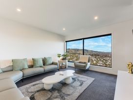 A living room with a sofa and coffee table at Nelson Holiday home in Nelson