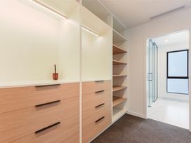 A dressing room with drawers and shelves at Nelson Holiday home in Nelson