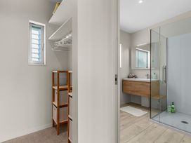 A bathroom with shower and sink at Mangawhai Heads