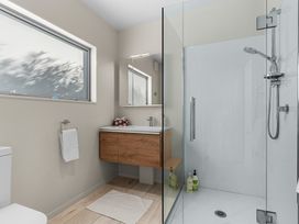 A bathroom with a sink and shower at Mangawhai Heads