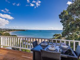 A table set for dining with ocean view at Paua Shell - Coopers Beach Holiday Home in Coopers Beach