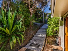 A pathway with stairs and plants at Paua Shell - Coopers Beach Holiday Home