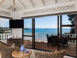 A living room with a beach view at Paua Shell - Coopers Beach Holiday Home, Coopers Beach