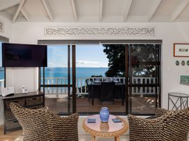 A living room with a view of the sea at Paua Shell - Coopers Beach Holiday Home Coopers Beach